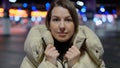 Young woman standing and looking at camera in underground parking garage. Royalty Free Stock Photo