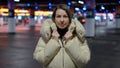 Young woman standing and looking at camera in underground parking garage. Royalty Free Stock Photo