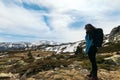 Young woman standing looking at mountain landscape. Snowy mountains Royalty Free Stock Photo