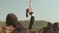 young woman is standing in the Mountain Pose Tadasana Urdhva Hastasana