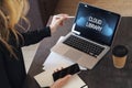 Woman is standing, pointing pencil on laptop computer with inscription on monitor- cloud library. Hipster girl working on pc Royalty Free Stock Photo