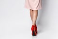 Young woman standing on one leg wearing high heels Royalty Free Stock Photo