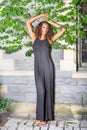 Young woman standing outdoors by wall in New York City, looking forward Royalty Free Stock Photo