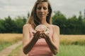 Young woman holding crystal ball Royalty Free Stock Photo