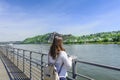 Young Woman Standing On Promenade By River In City During Summer Royalty Free Stock Photo