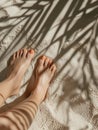 Young woman standing on sandy beach with shadows. Tanned female legs with smooth skin and orange nail polish. Generative AI