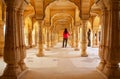 Young woman standing in Sattais Katcheri Hall, Amber Fort, Jaipur, India