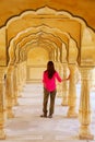 Young woman standing in Sattais Katcheri Hall, Amber Fort, Jaipur, India Royalty Free Stock Photo