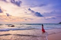 Young woman standing in sea waves. Sky and sea Beautiful sunset Royalty Free Stock Photo