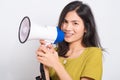 Young woman standing smile holding and shouting into megaphone Royalty Free Stock Photo