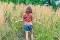 Young woman standing in tall grass Royalty Free Stock Photo