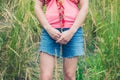 Young woman standing in tall grass Royalty Free Stock Photo