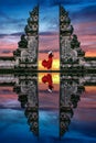 Young woman standing in temple gates at Lempuyang Luhur temple in Bali, Indonesia