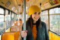 Young woman standing in a wagon of a driving tramway. Transportation, travel and lifestyle concept Royalty Free Stock Photo