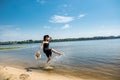 young woman stands barefoot in river Royalty Free Stock Photo