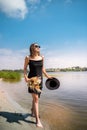 young woman stands barefoot in river Royalty Free Stock Photo