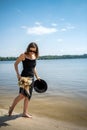 young woman stands barefoot in river Royalty Free Stock Photo