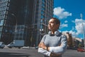 A young woman stands in the city center