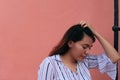 Young woman staring blankly into the air while standing in the city Royalty Free Stock Photo