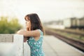 Young woman on the station platform Royalty Free Stock Photo