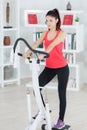 Young woman on stepper machine