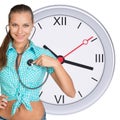 Young woman with stethoscope and clock