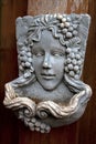 Young woman stone mask with decoration of grapes Royalty Free Stock Photo