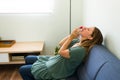 Young woman stopping a nosebleed