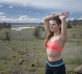 Young woman stops for rest during workout Royalty Free Stock Photo