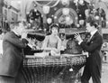 Young woman in a store and ignoring two men with megaphones Royalty Free Stock Photo