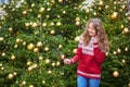 Young woman on a street of Paris decorated for Christmas Royalty Free Stock Photo