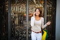 Young woman at the street with shopping bags talking on mobile phone Royalty Free Stock Photo