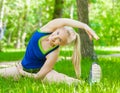 Young woman stretching the muscles before jogging Royalty Free Stock Photo