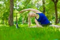 Young woman stretching the muscles before jogging Royalty Free Stock Photo