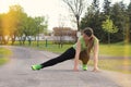 Young woman stretching outdoors