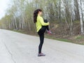 Young woman stretching outdoors in nature. Fitness, sports. Lifes