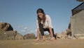 Young woman stretching. Yoga poses, low angle