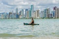 Young woman strolling by kayak on Brazilian beach. Fishing kayak Royalty Free Stock Photo