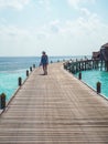 Young woman strolling on a wooden pier