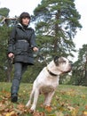 Young woman and strong dog Royalty Free Stock Photo