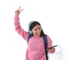 Young woman or student girl with mobile phone listening to music headphones singing and dancing Royalty Free Stock Photo