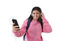 Young woman or student girl with mobile phone listening to music headphones singing and dancing Royalty Free Stock Photo