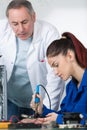 young woman student repairing electronics device Royalty Free Stock Photo