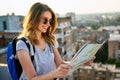 Young woman, student traveler with backpack enjoying summer vacation.