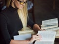 Young woman student of the University. Preparing exam and learning lessons in public library. Royalty Free Stock Photo