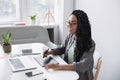 Young woman student using laptop computer at home, studying online. Creative professional working in office Royalty Free Stock Photo