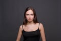 Young woman studio headshot portrait on dark background Royalty Free Stock Photo
