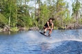 Young woman study riding wakeboarding on a lake