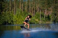 Young woman study riding wakeboarding on a lake Royalty Free Stock Photo