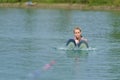 Young woman study riding wakeboarding on lake